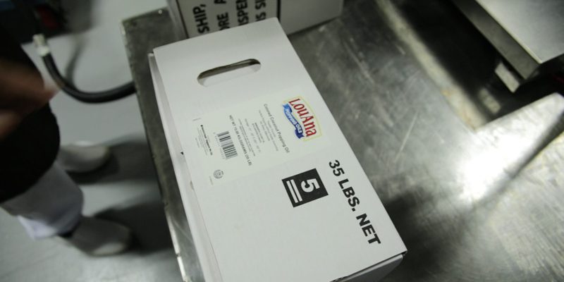 white packaging carton on metal table inside export team department