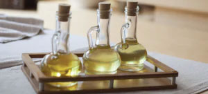 three bottles of specialty oil