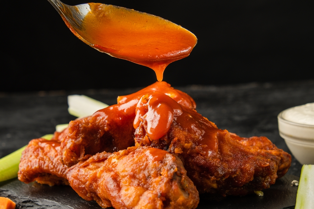 sauce pouring on chicken
