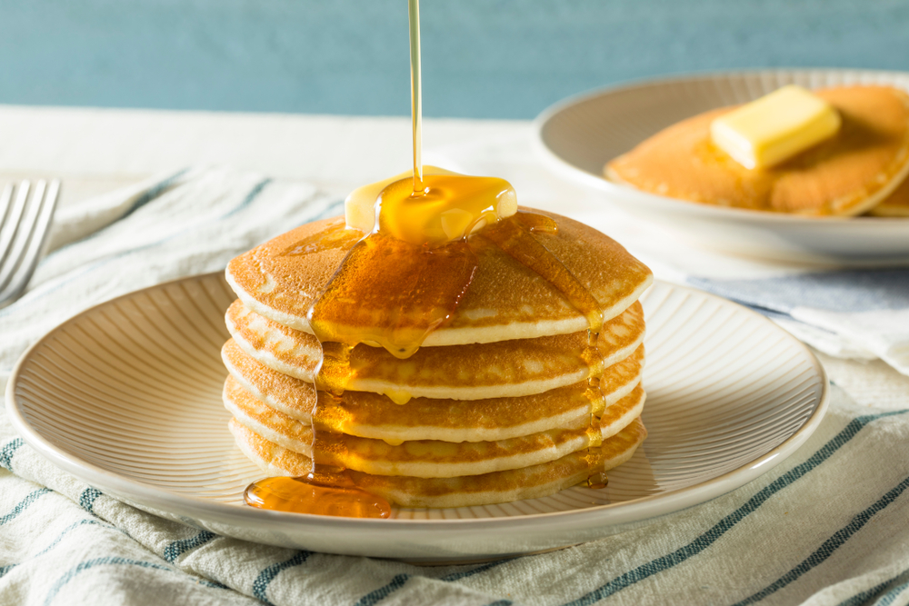 home-made pancake with butter on top and syrup