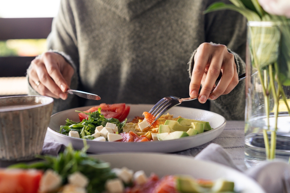 a woman eating healthy breakfast