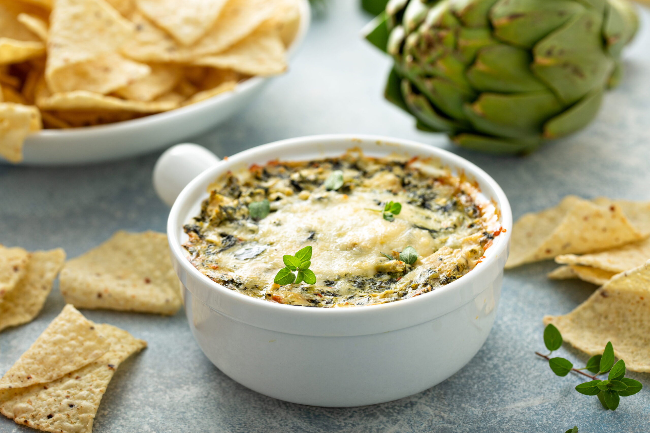 spinach artichoke dip with nachos on the side
