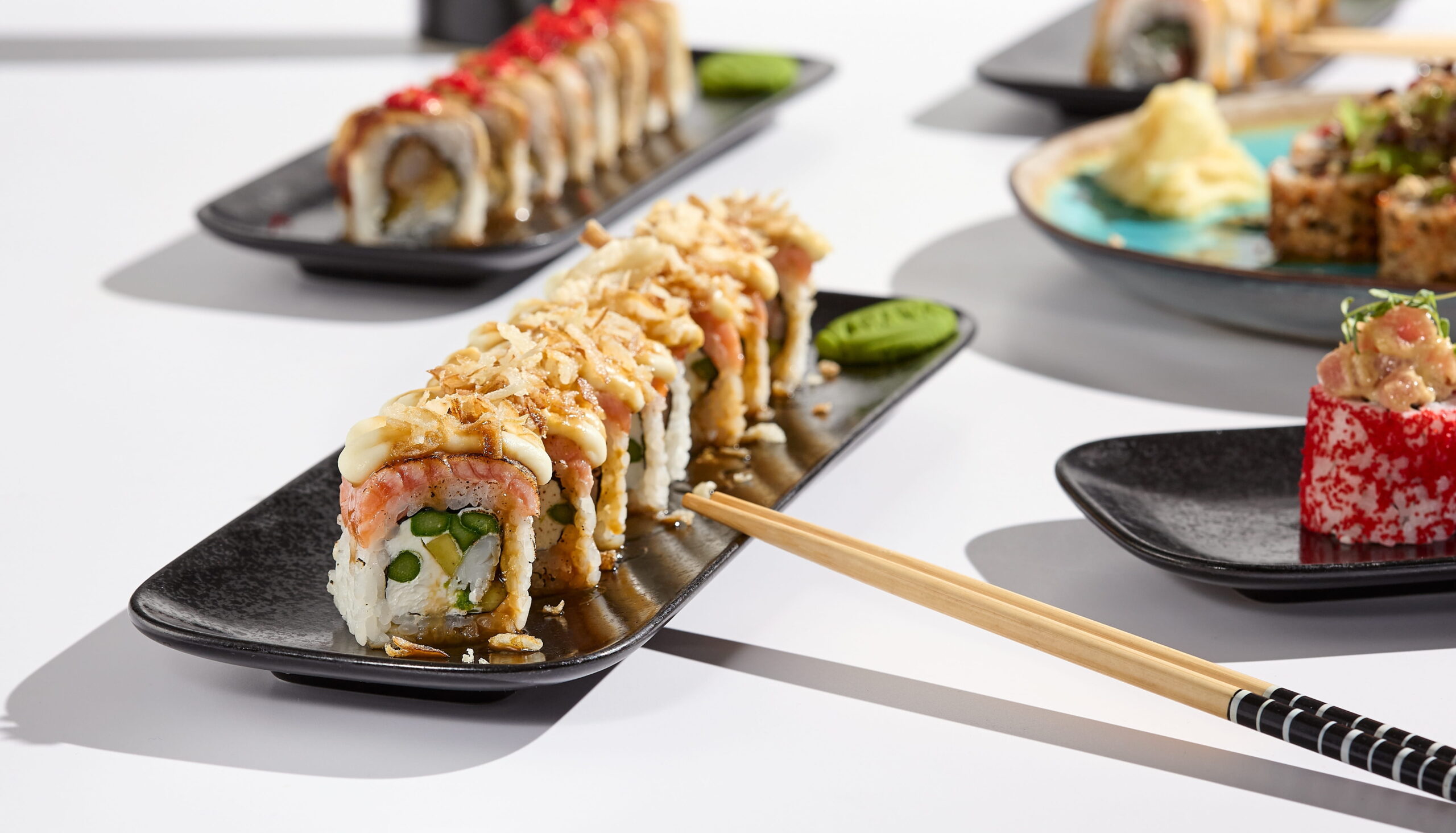 sushi rolls topped with truffle mayonnaise
