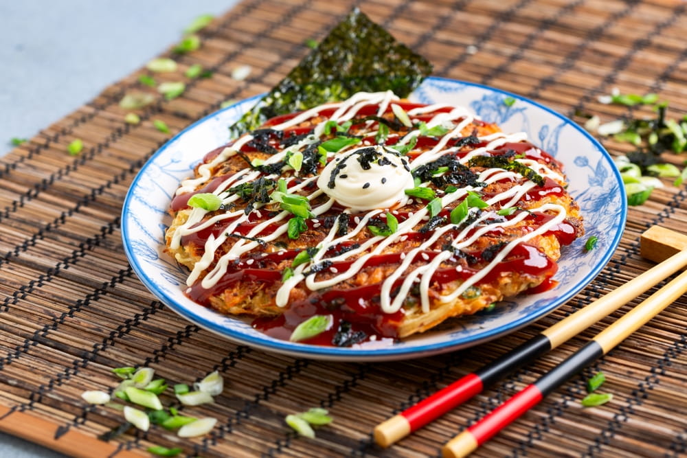 okonomiyaki topped with a japanese mayonnaise