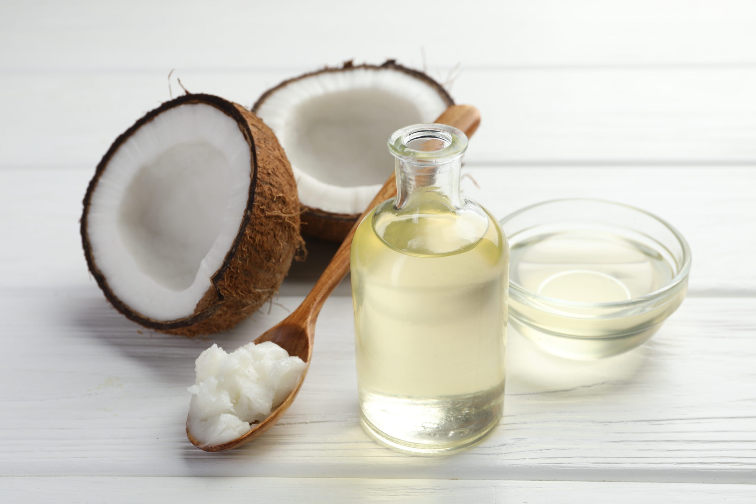 organic coconut cooking oil on white wooden table